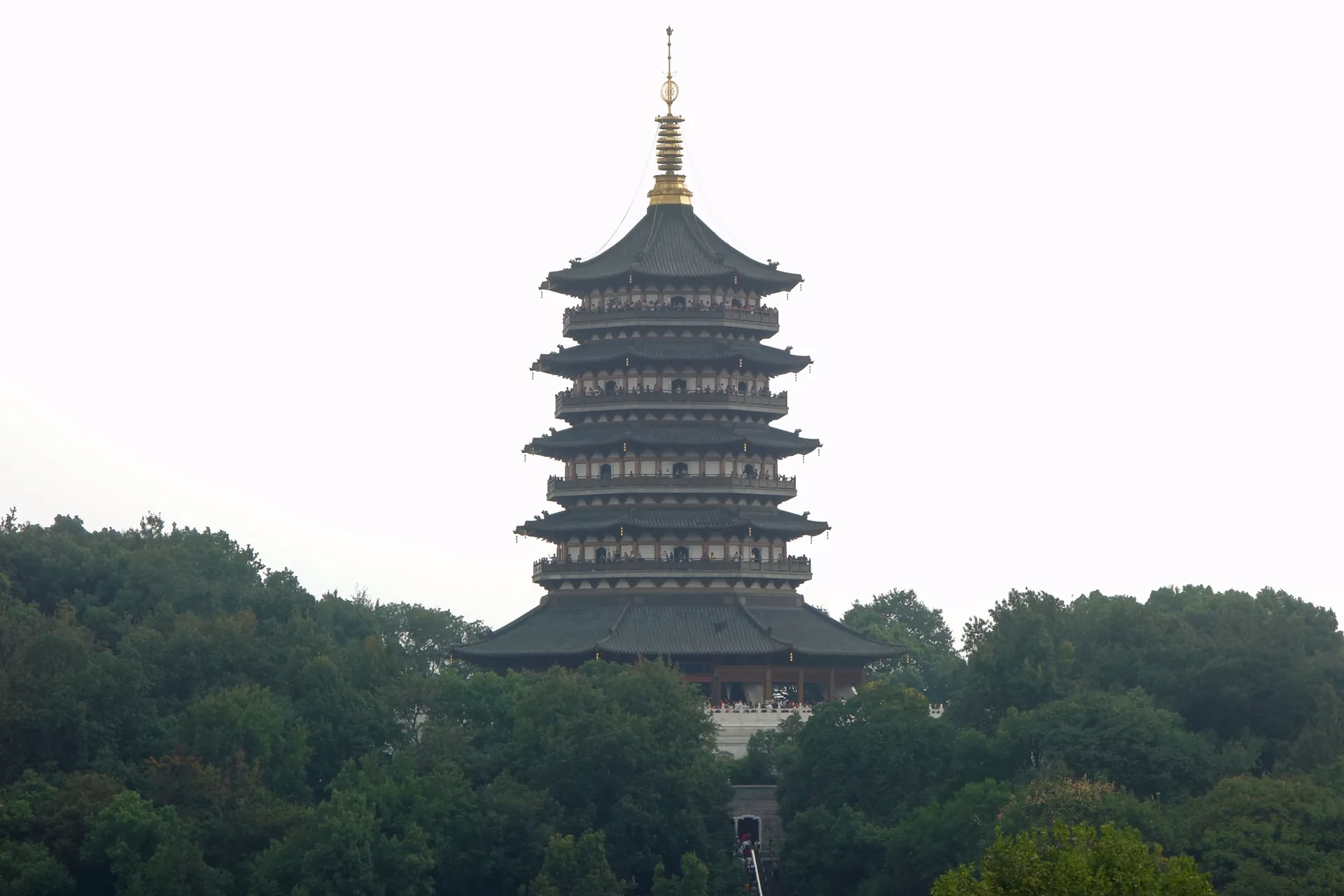 Leifeng Pagoda rising above trees on the south side of West Lake