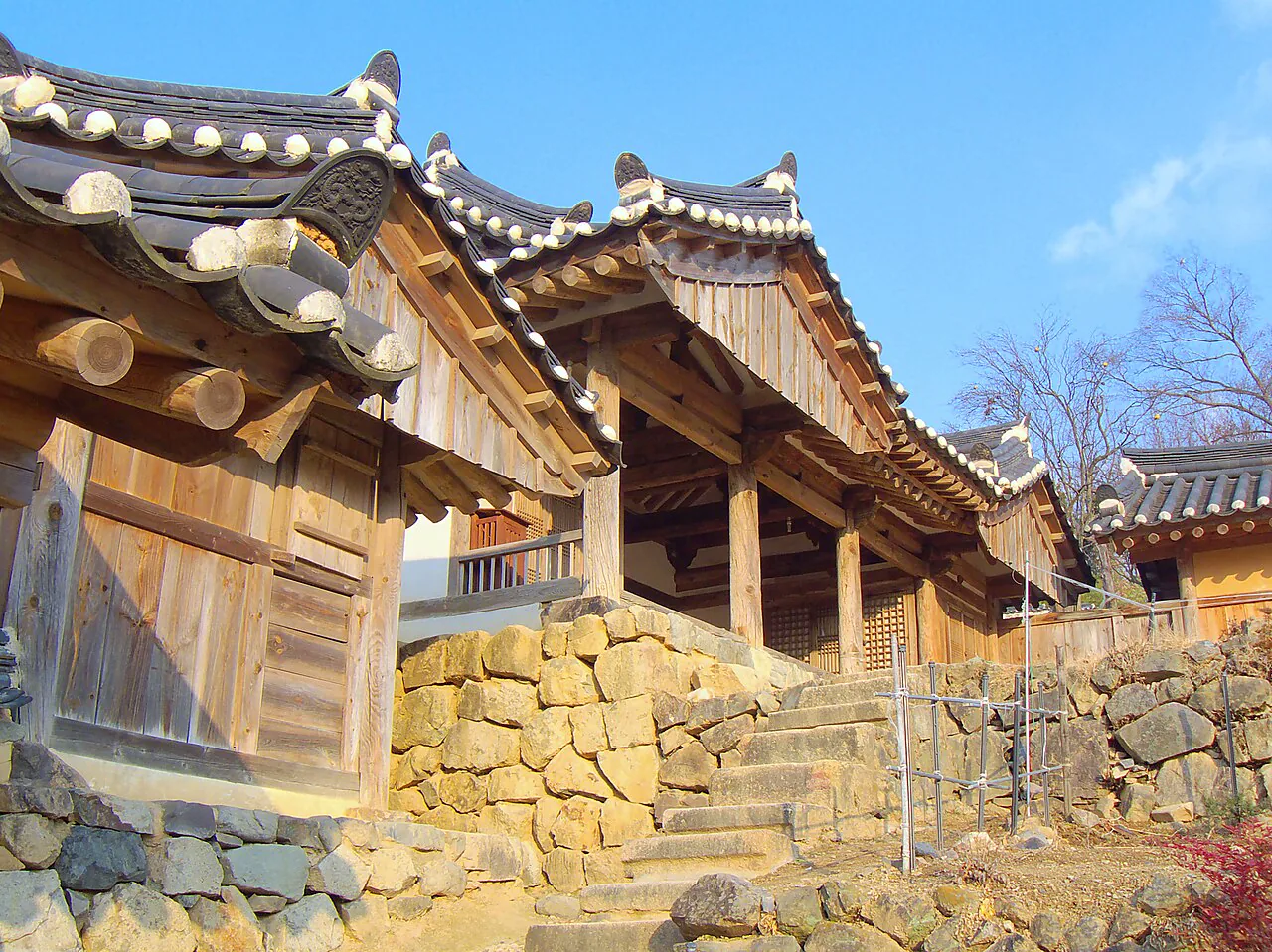 Timber hanok buildings and stone walls in Yangdong Village