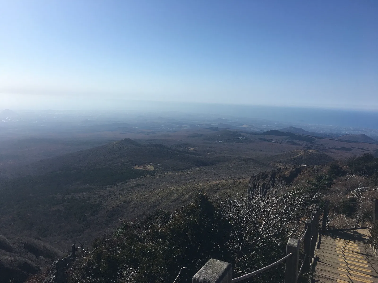 Rocky Hallasan trail and mountain landscape under an open sky