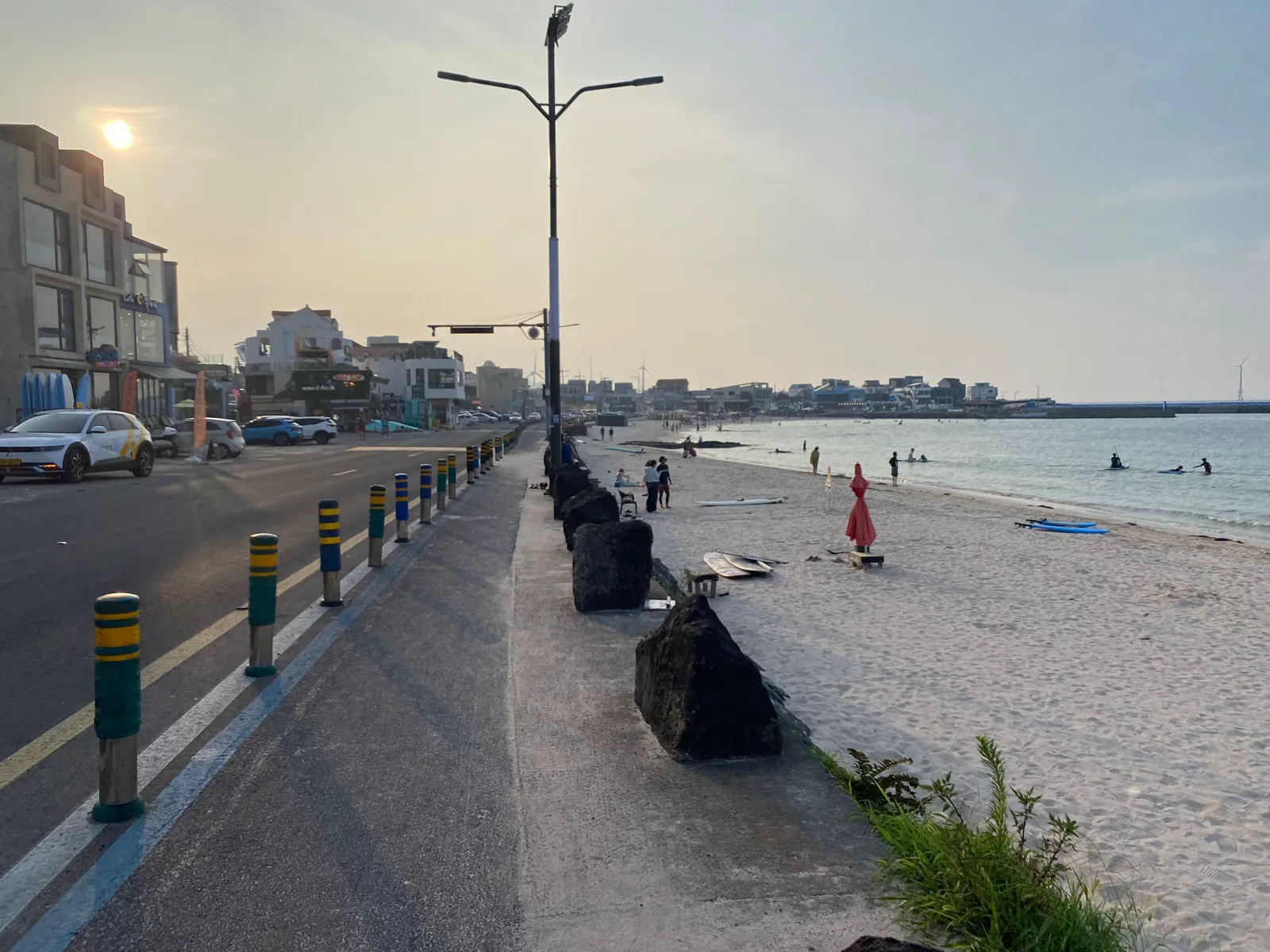 Bright water, pale sand and basalt at Woljeongri Beach