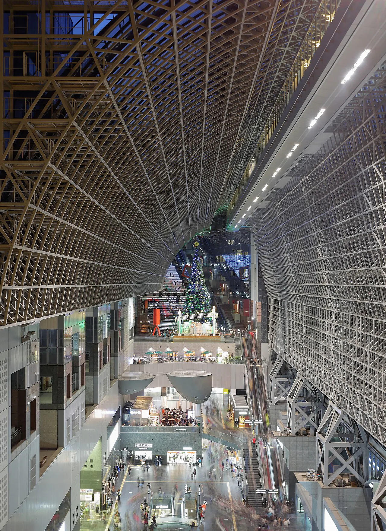Modern steel and glass atrium inside Kyoto Station