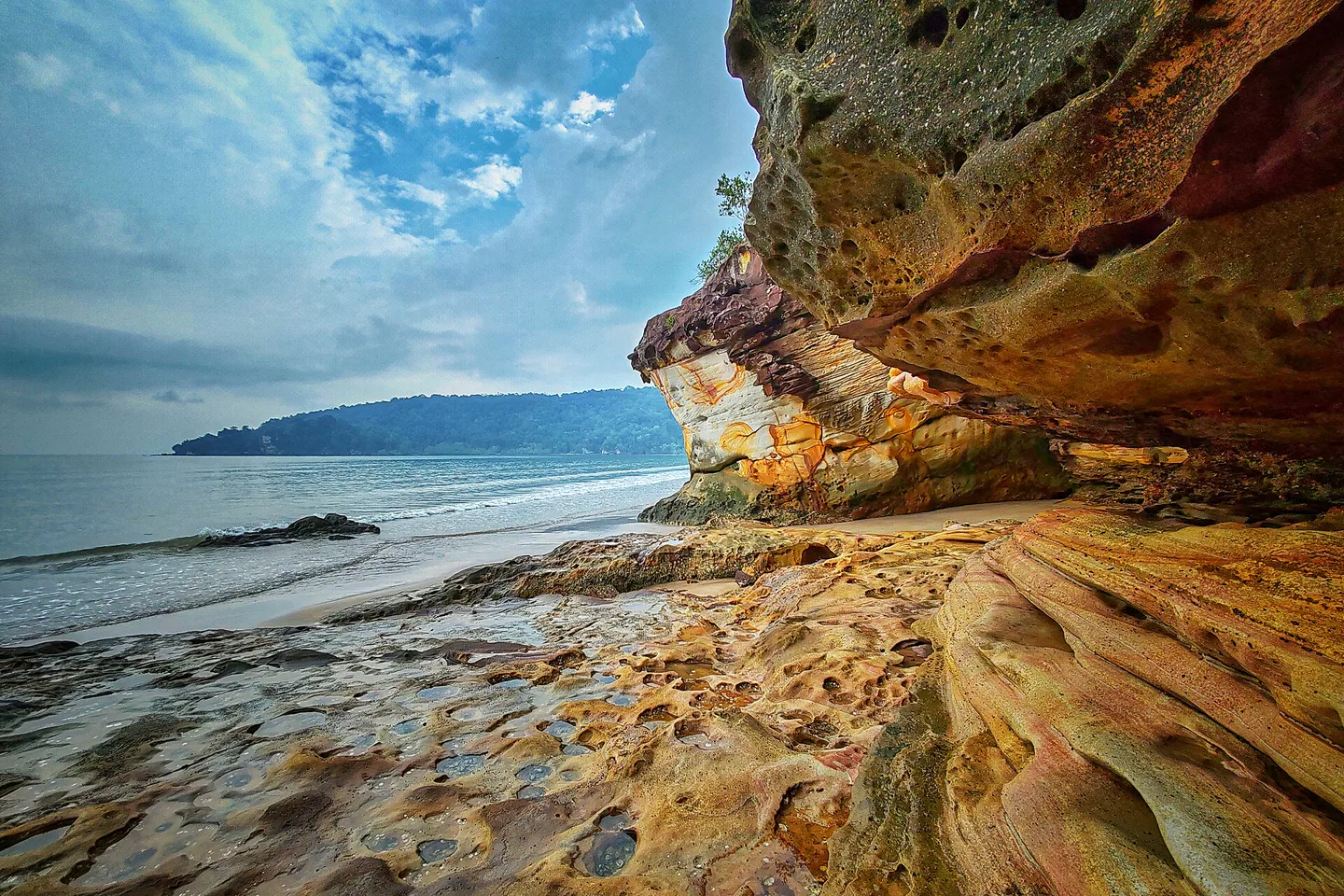 Layered sandstone overhang beside the sea in Bako National Park