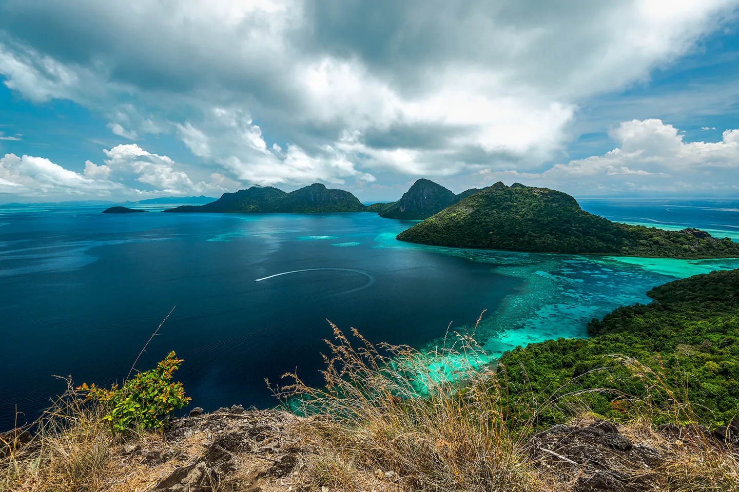 Turquoise channels and steep green islands viewed above Semporna