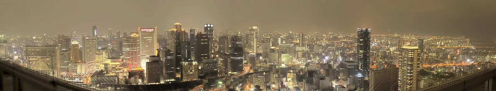 Wide Osaka skyline under an evening sky