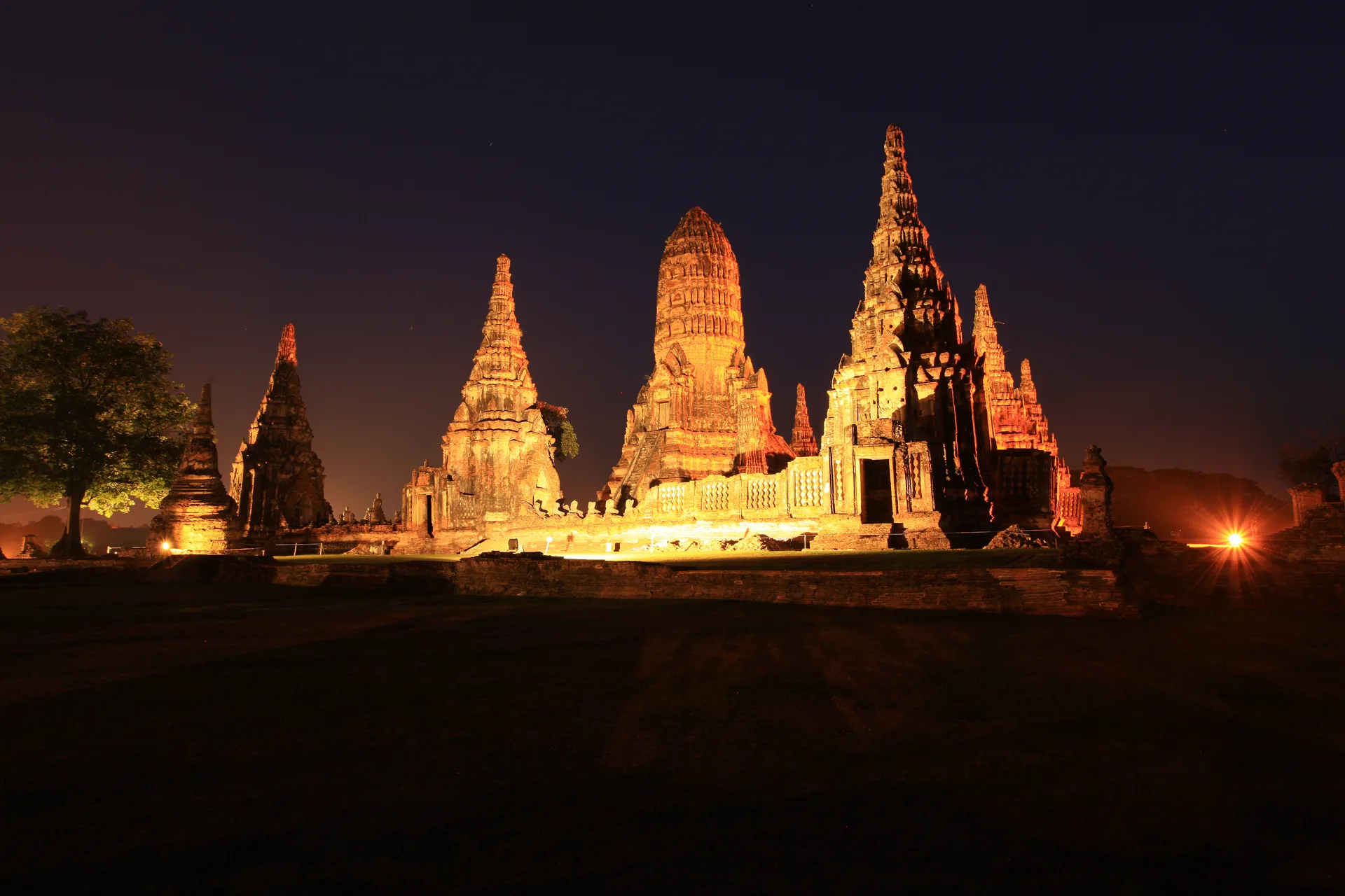 Illuminated prang at Wat Chaiwatthanaram after sunset