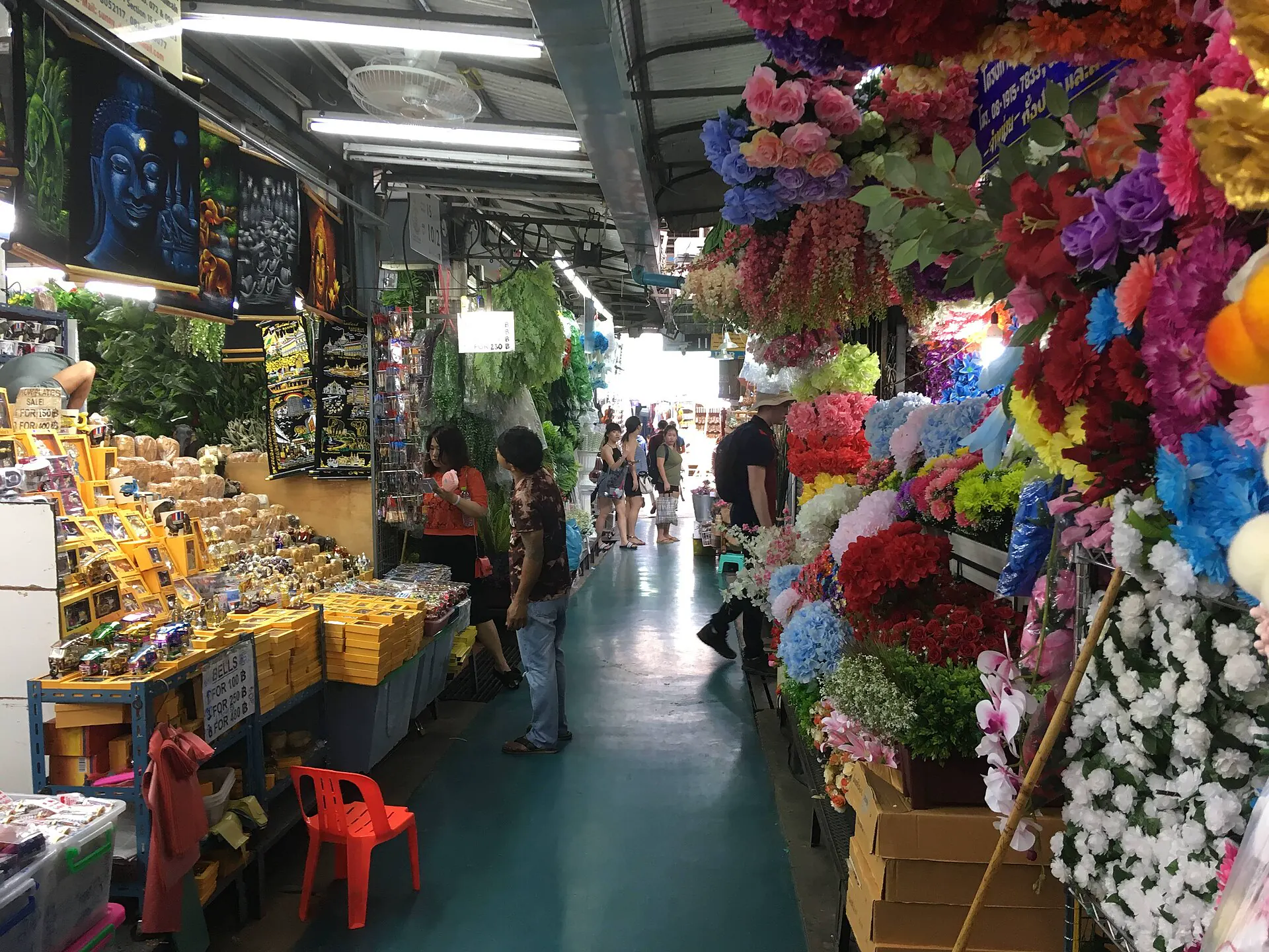Colorful flowers and market goods inside Chatuchak Weekend Market