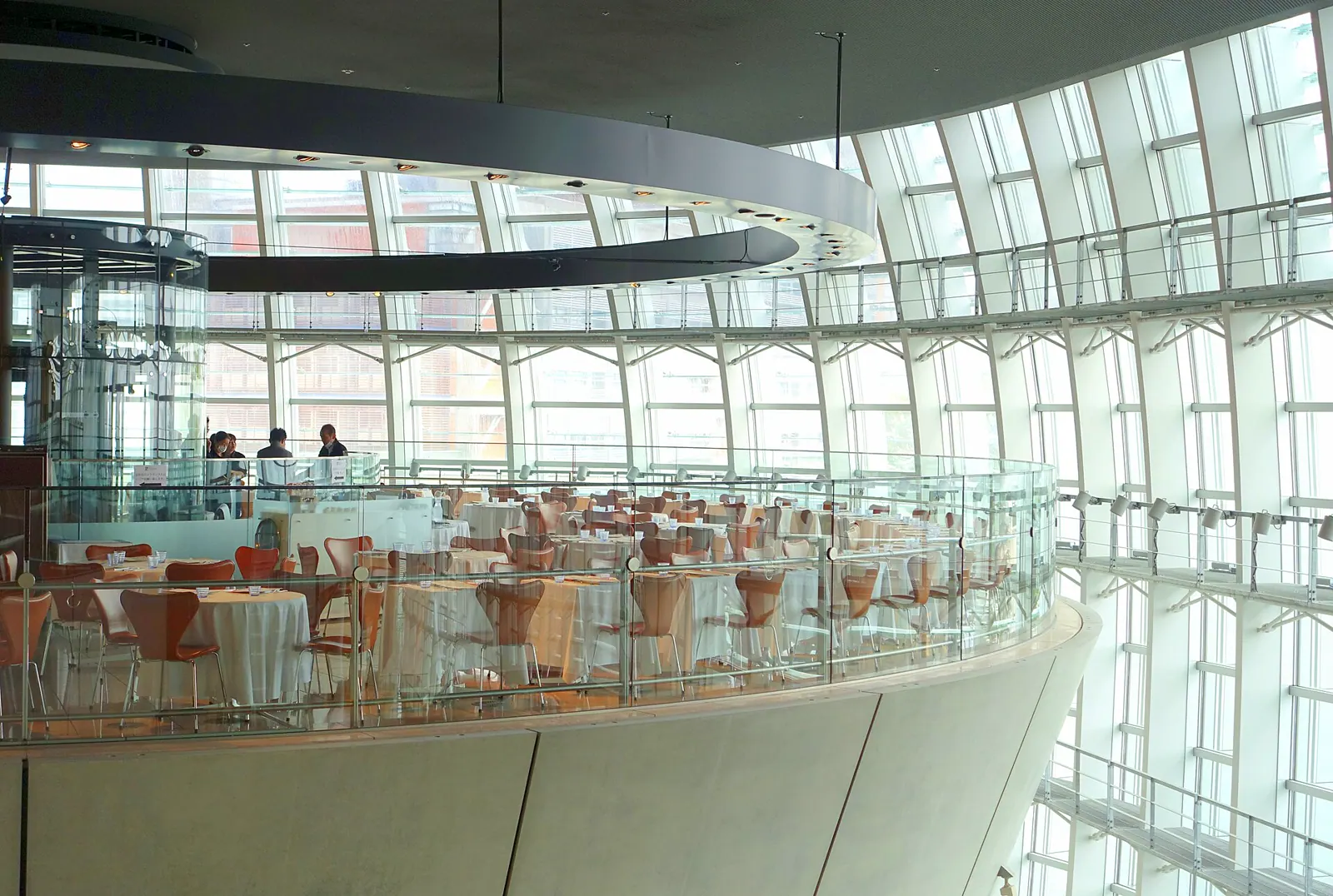 Curving glass facade and interior of the National Art Center Tokyo