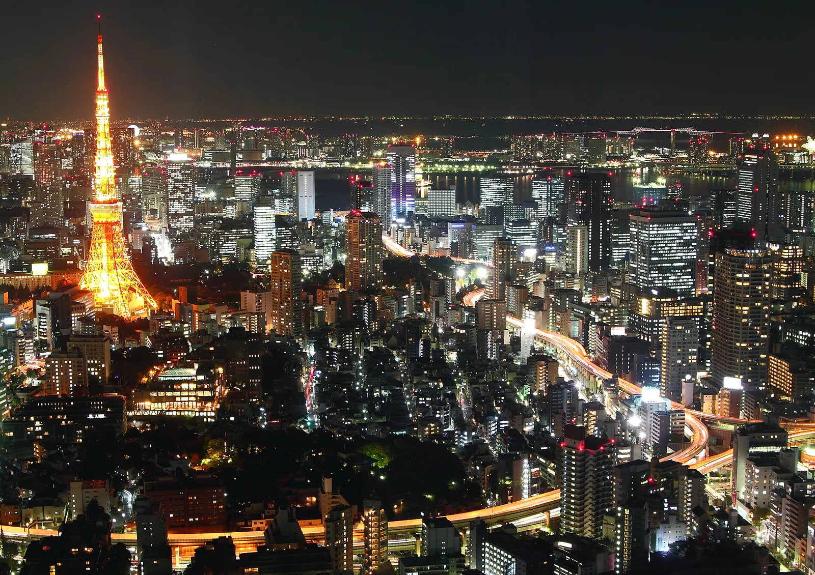 Tokyo Tower glowing orange over the city at night