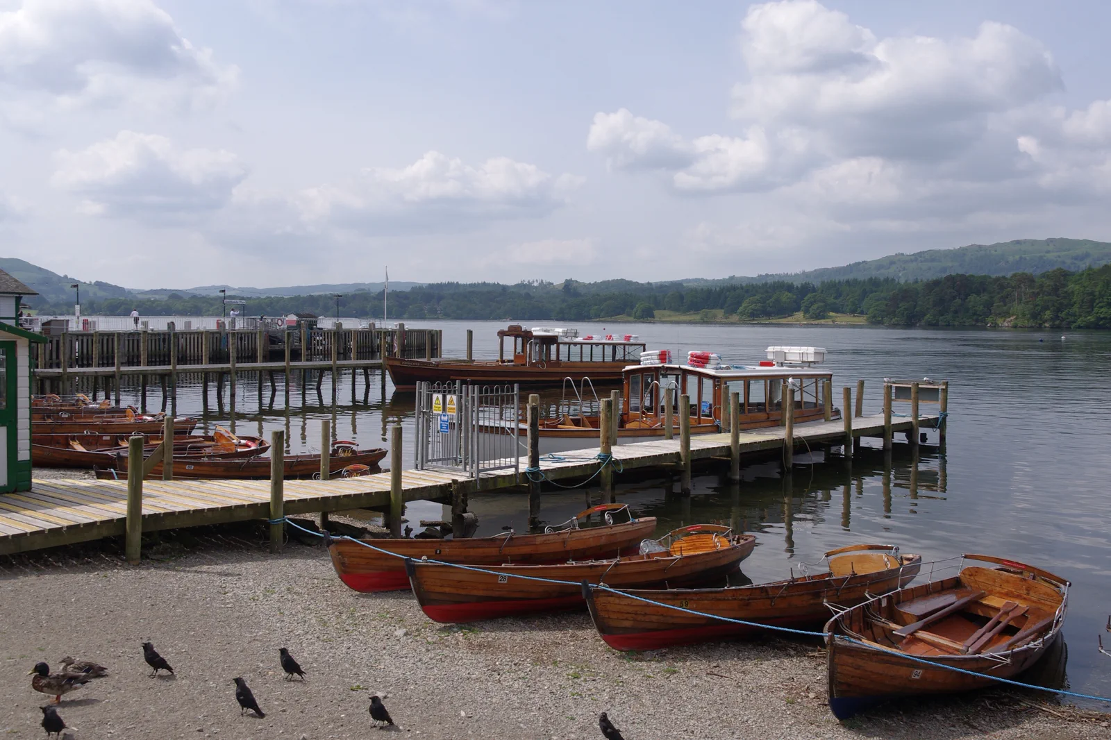 Boats on Windermere with the Lake District fells beyond